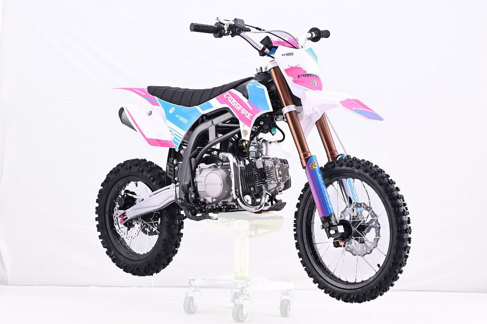 Red and Black Dirt Bike on a White Stand, Against a White Backdrop — MPE Adventure Quads & Bikes In Thornton, NSW