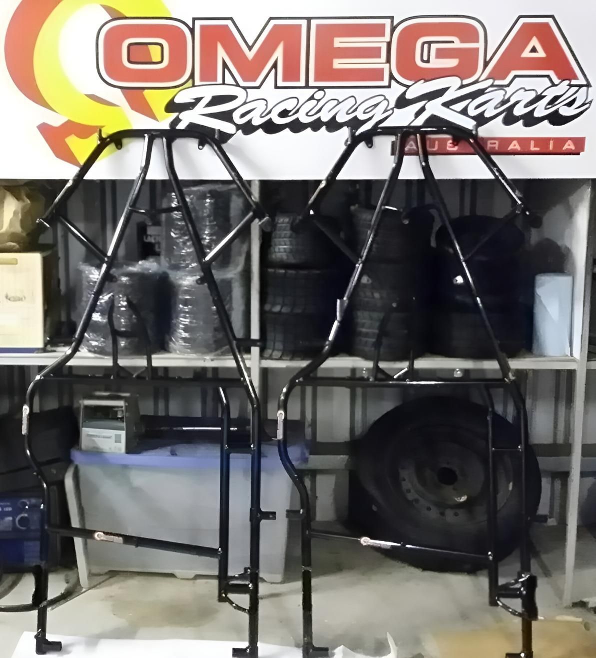 A Black and Red Atv Is Parked in A Grassy Field — MPE Adventure Quads & Bikes In Thornton, NSW