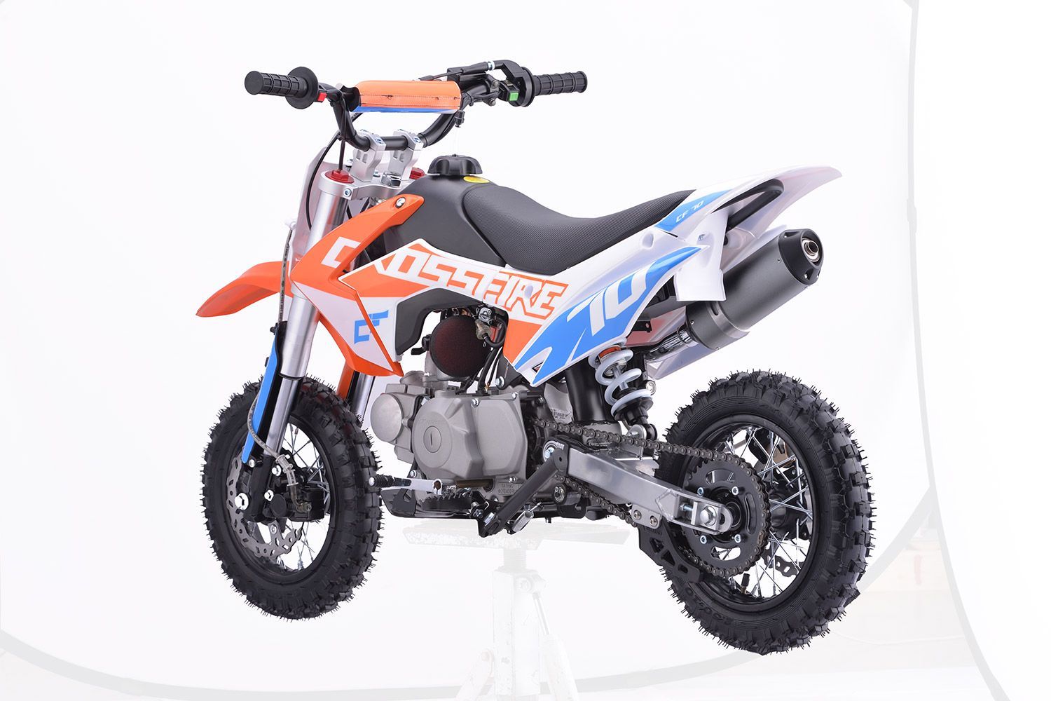 A Red Dirt Bike is on a White Background — MPE Adventure Quads & Bikes In Thornton, NSW