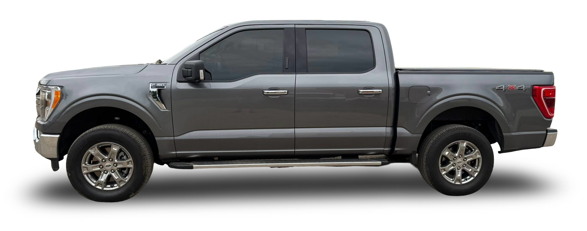 A gray ford f150 pickup truck is shown from the side on a white background.
