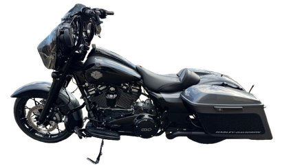 A red pickup truck is shown from the side