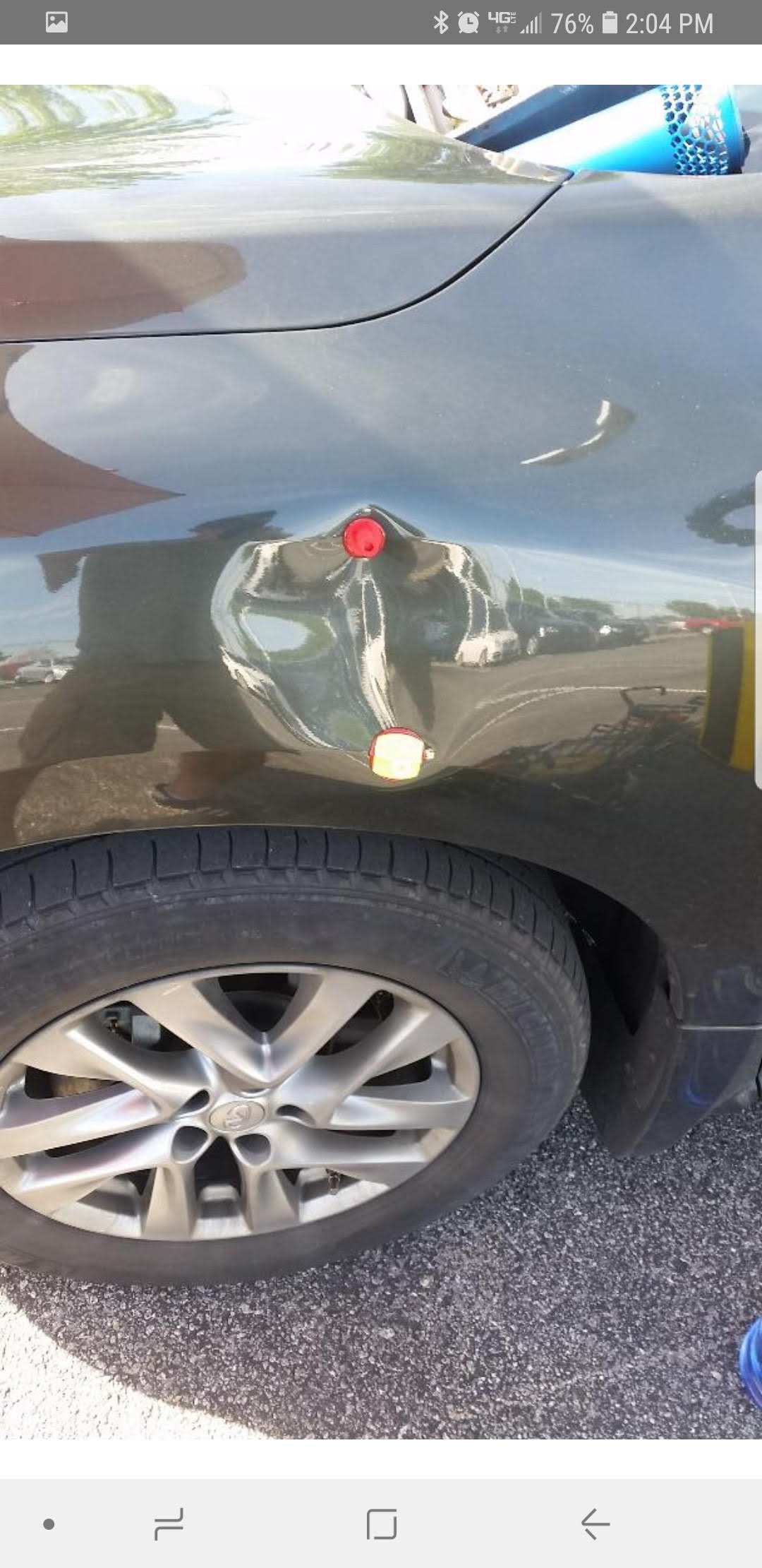 Paintless dent repair before and after.