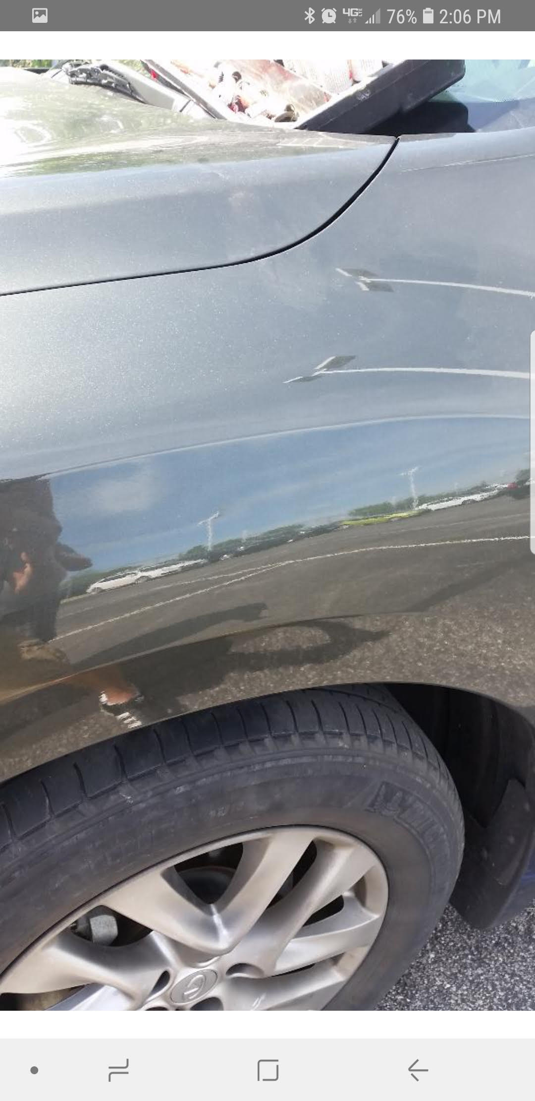 Paintless dent repair before and after.