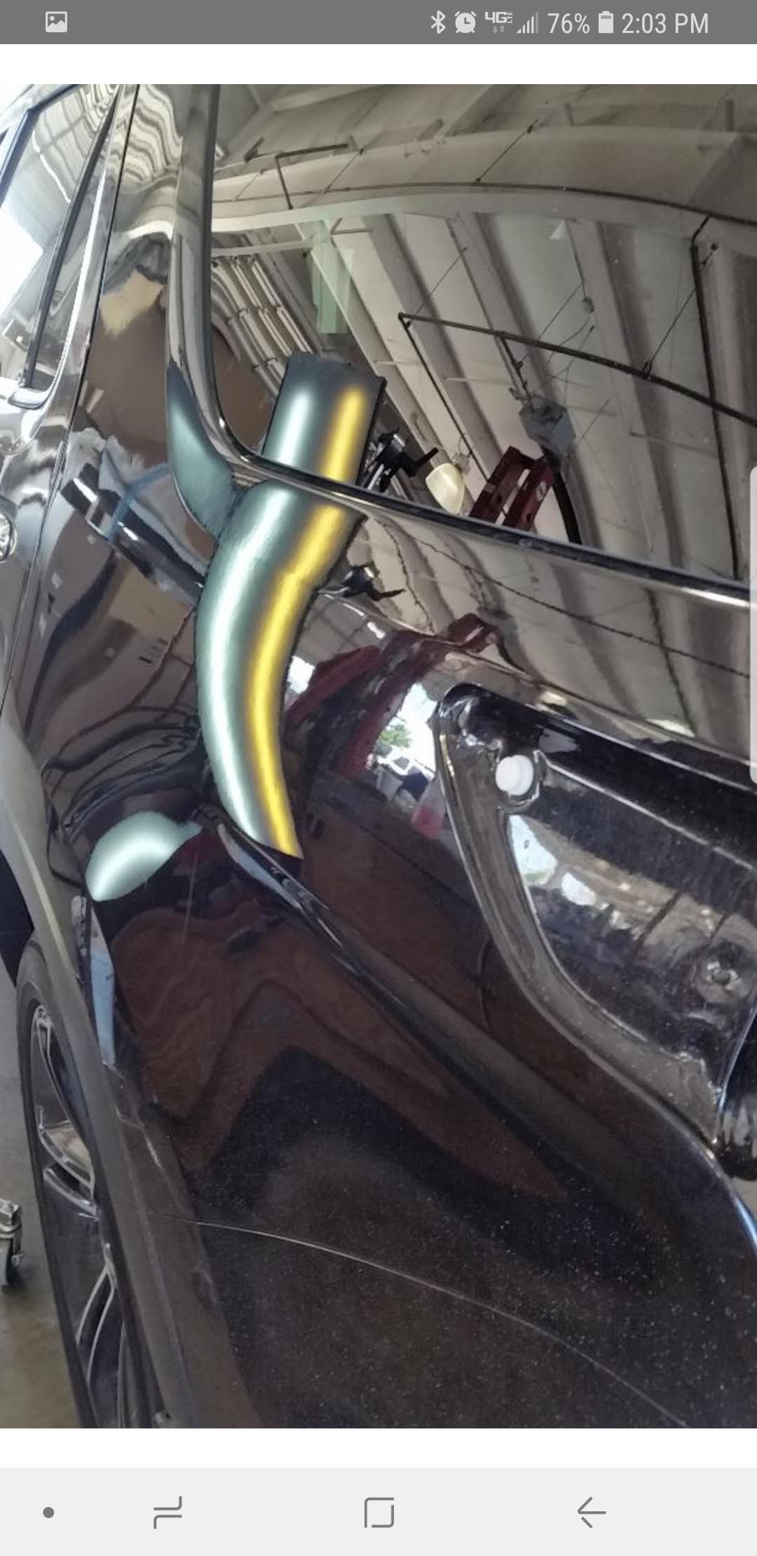 Paintless dent repair before and after.