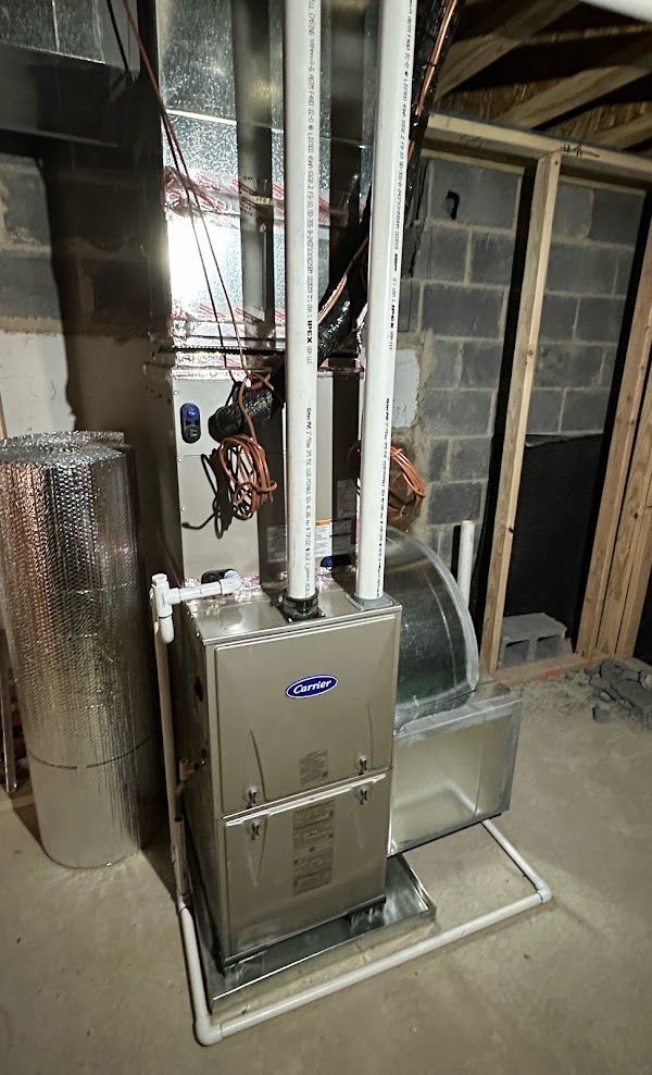 Carrier furnace installation with complete ductwork by Alex HVAC Service LLC in basement