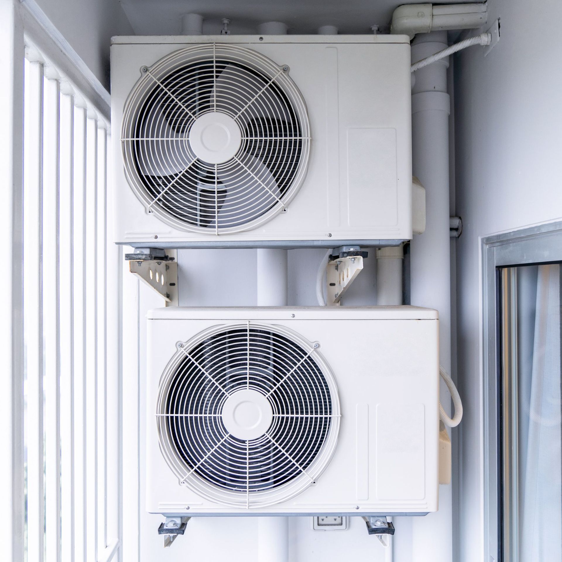 Ductless HVAC installation with stacked mini-split systems by Alex HVAC Service LLC