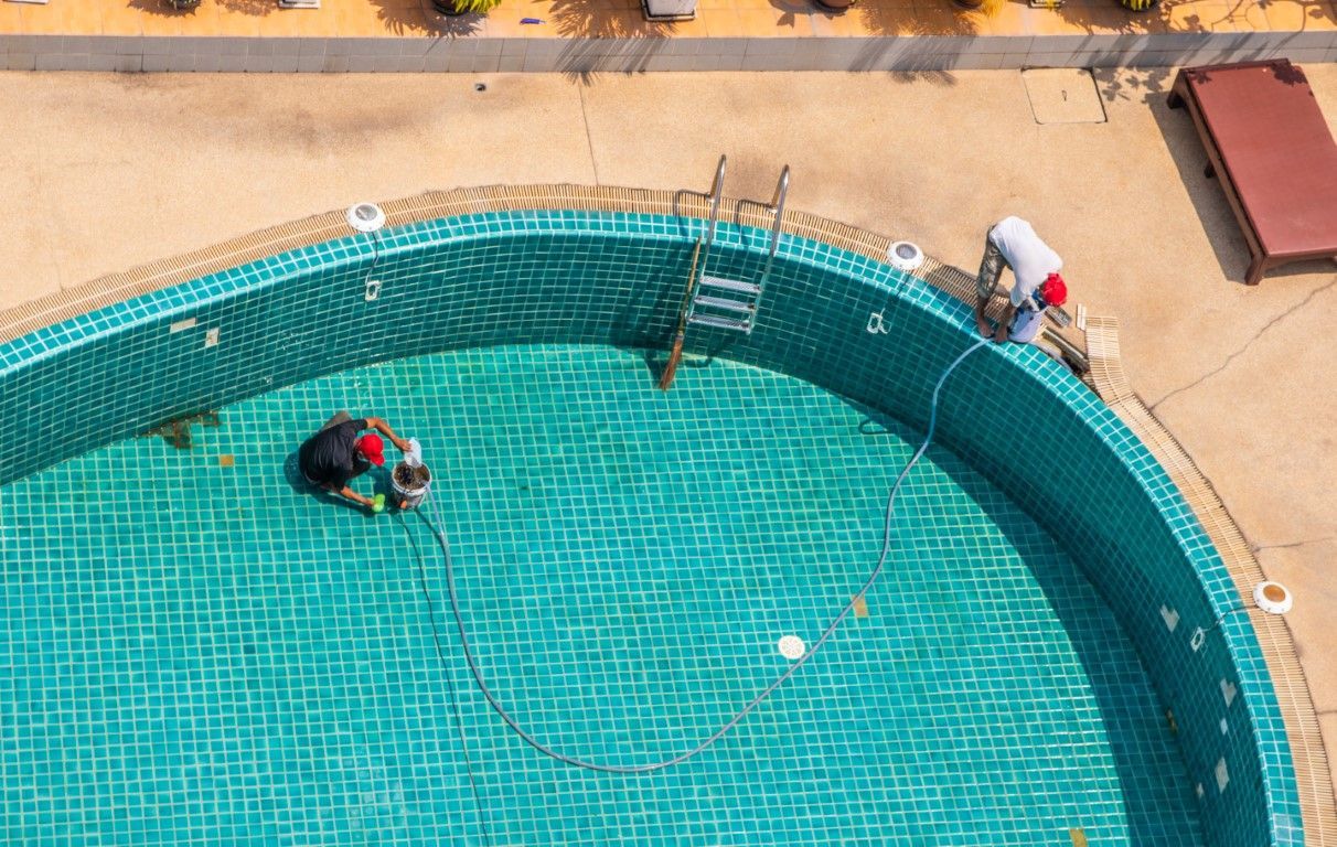 Technicians Surfacing Pool Floor Photo