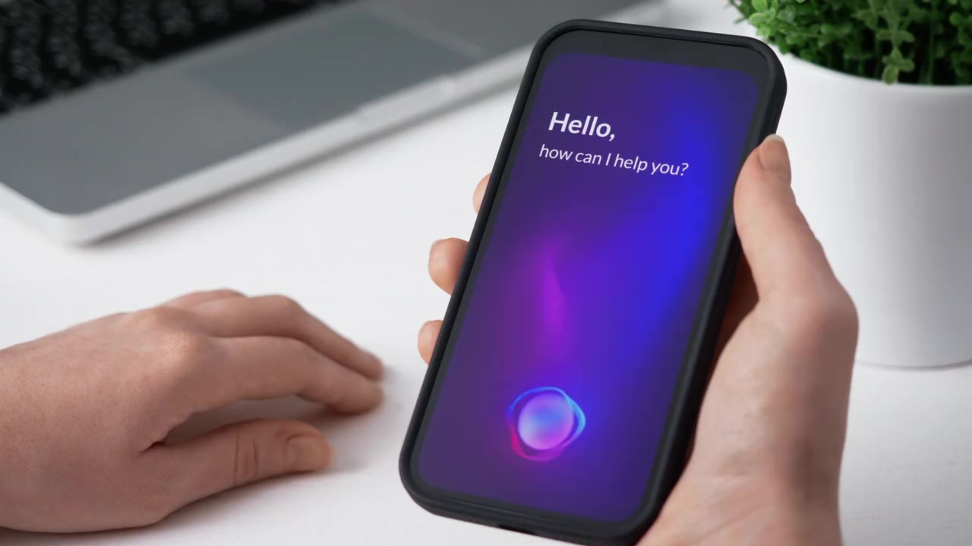 A person is holding a smart phone in their hand.