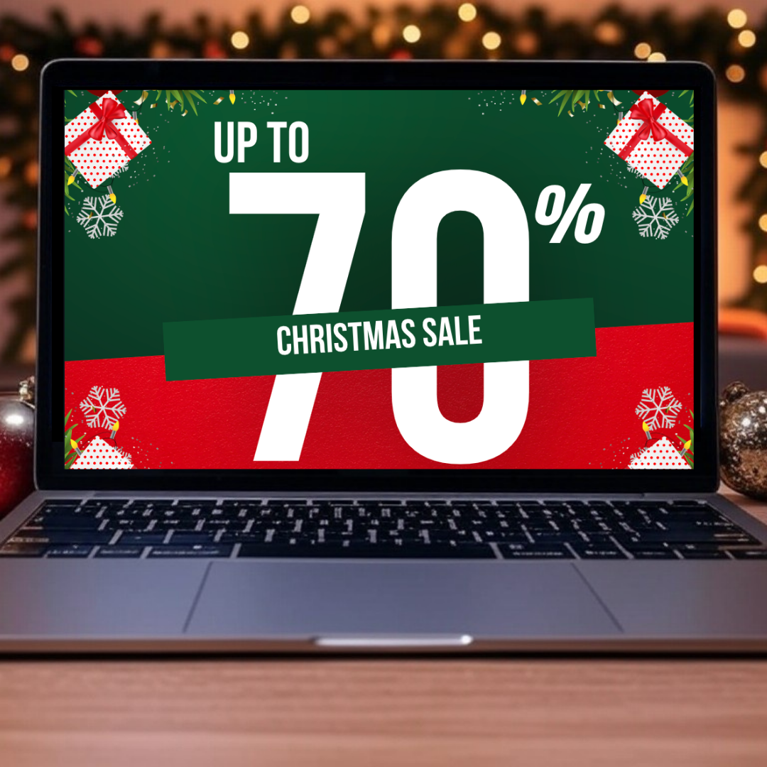 A laptop with a christmas sale advertisement on the screen