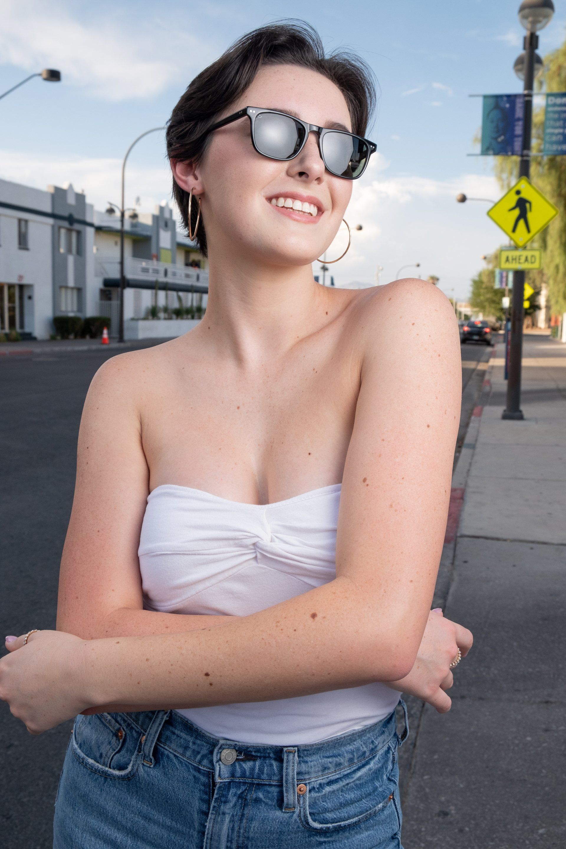 Woman in sunglases posing for Express Photography Package with De Vera Imagery