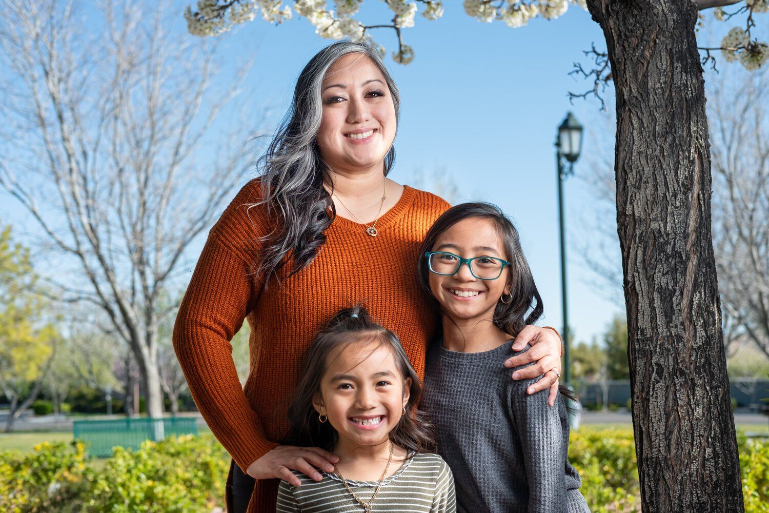 Mother and two children posing for Express Photography Package with De Vera Imagery