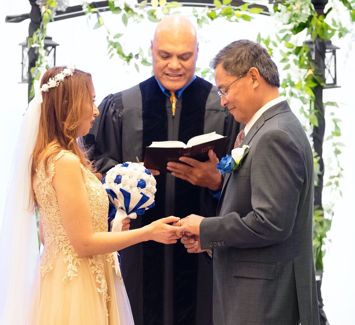 couple reciting vows in front of wedding officiant shot from a Wedding Photography Package with De Vera Imagery