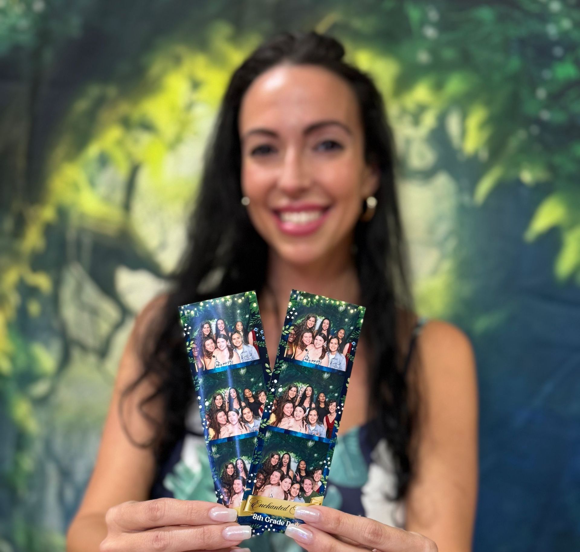 A photo booth with a red carpet and a ring light.