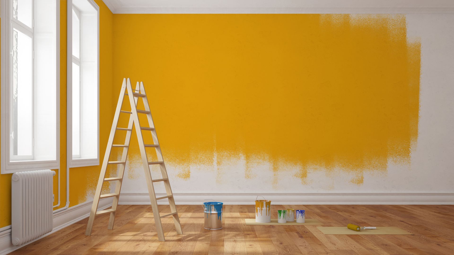 A room with one wall partially painted yellow; a ladder, paint cans, and brushes on hardwood floor.