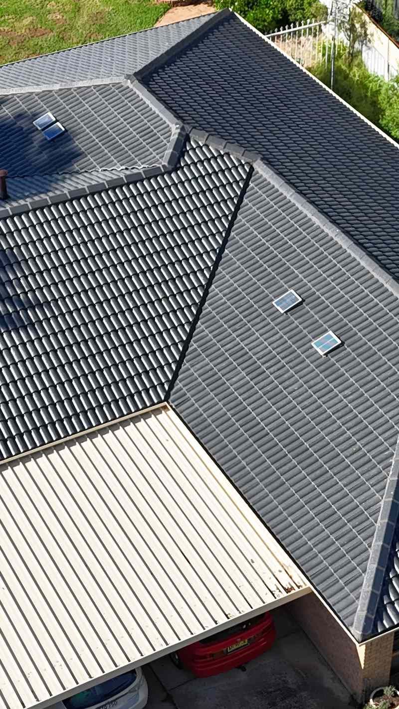 An Aerial View Of A House With A Tiled Roof And A Pergola — Lance Ward Roof Tiling in Bathurst, NSW