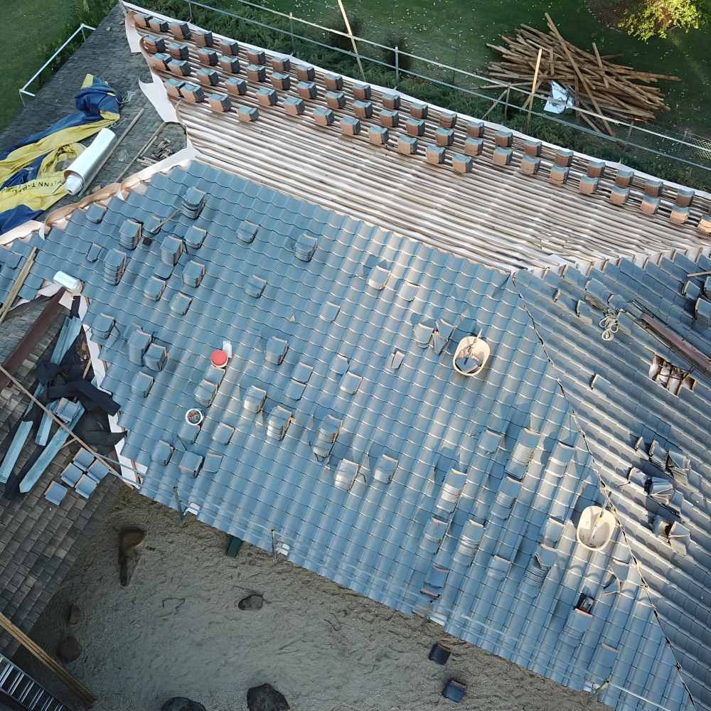 An Aerial View Of A Roof That Is Being Repaired — Lance Ward Roof Tiling in Orange, NSW