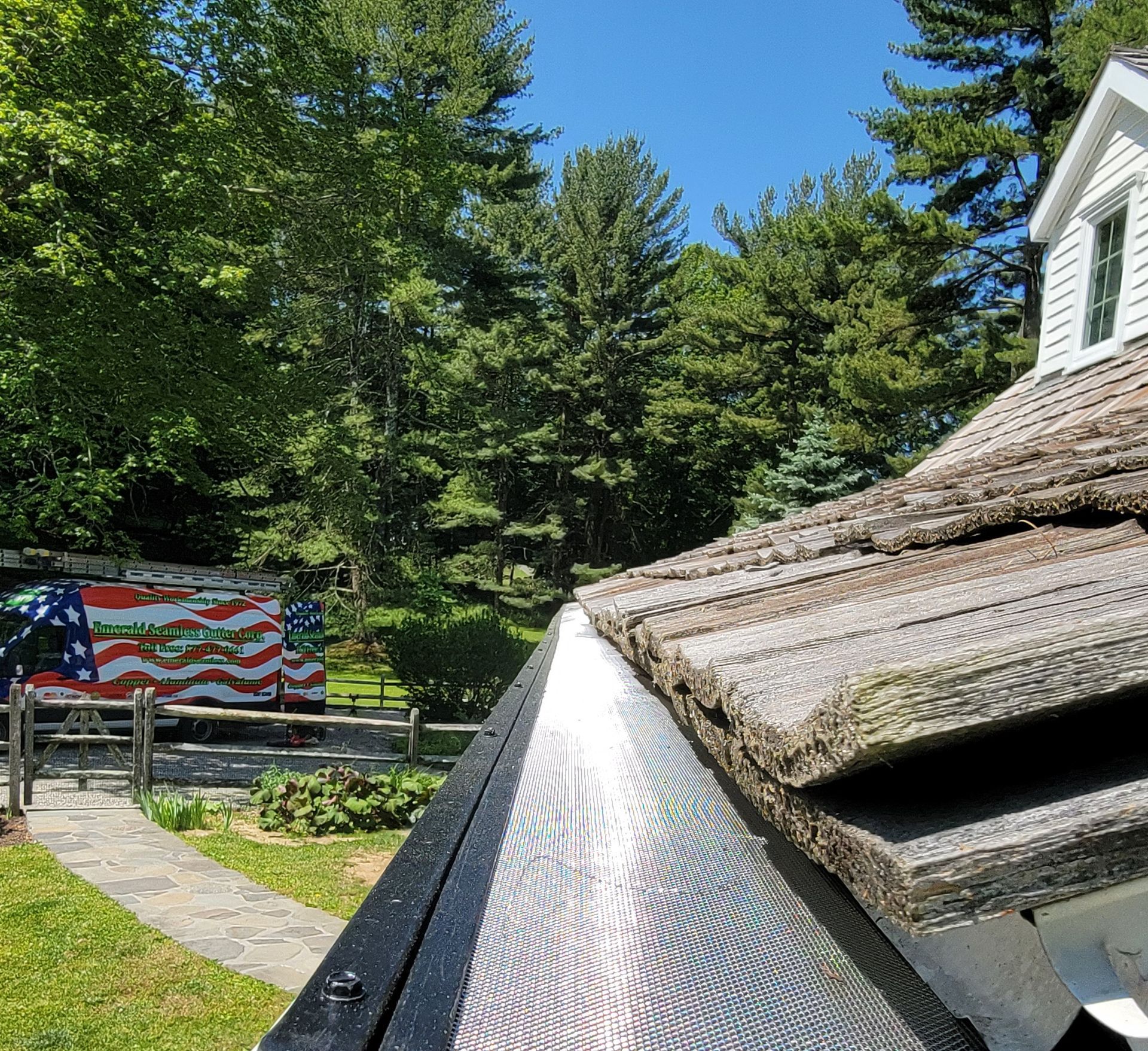 A house with a roof that has shingles on it