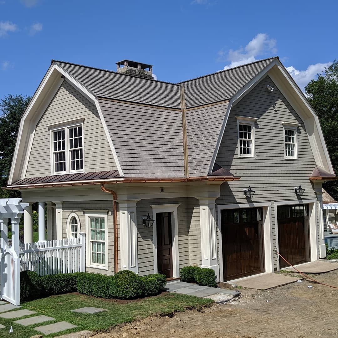 A house with a large roof and a lot of windows