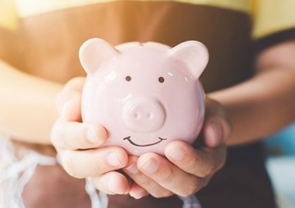 Financial Planning — Holding a Piggy Bank in Delray Beach, FL