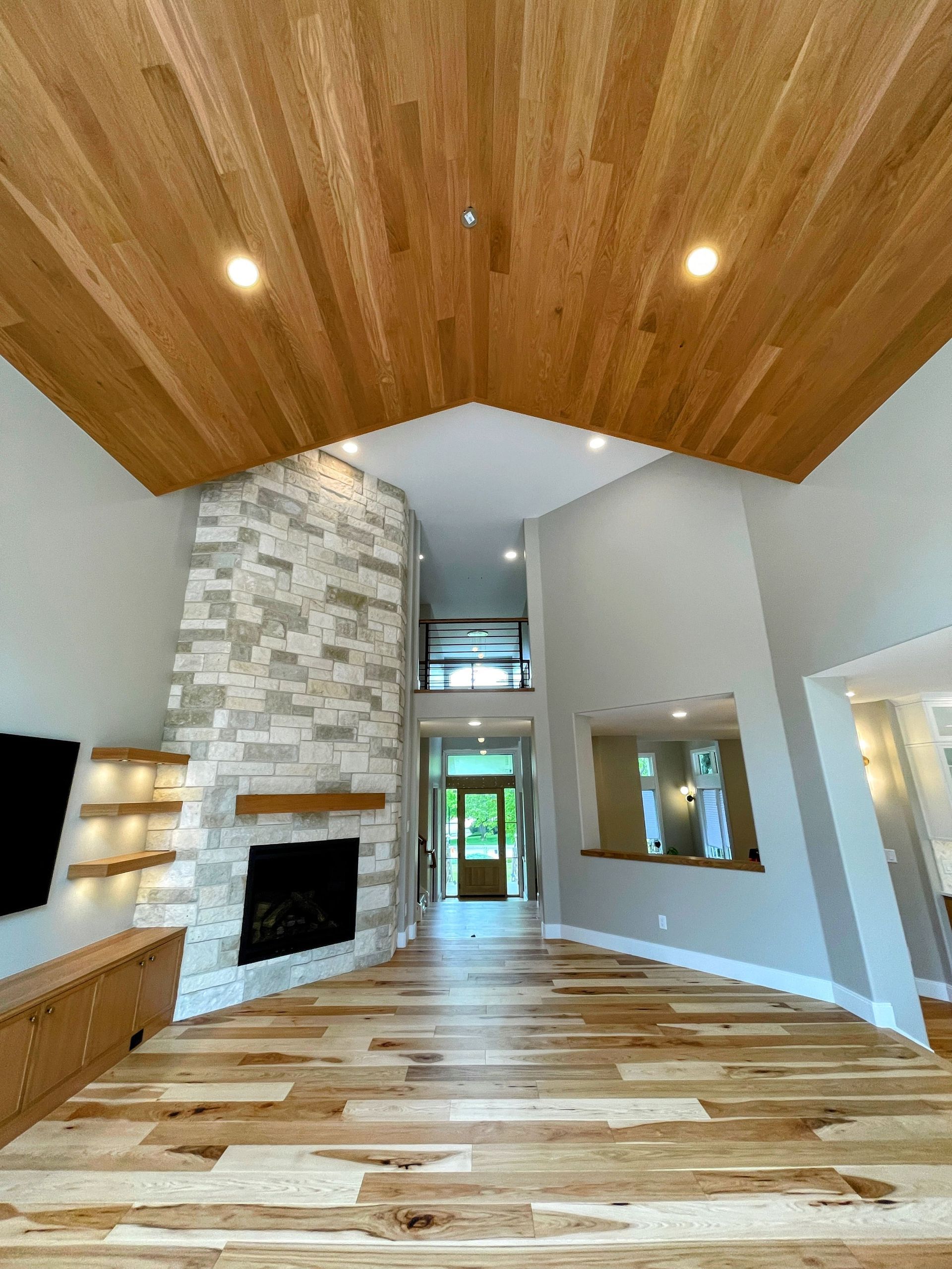 A kitchen with a sink and a marble counter top.