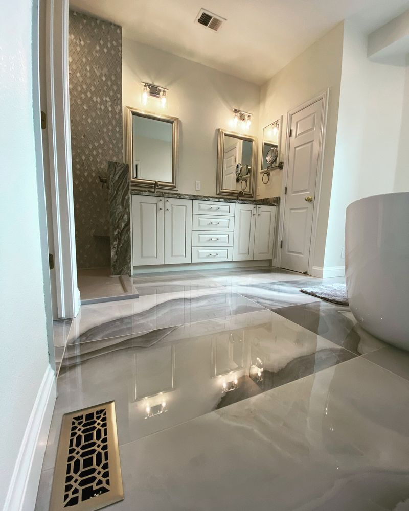 A bathroom with two sinks , two mirrors , and a bathtub.