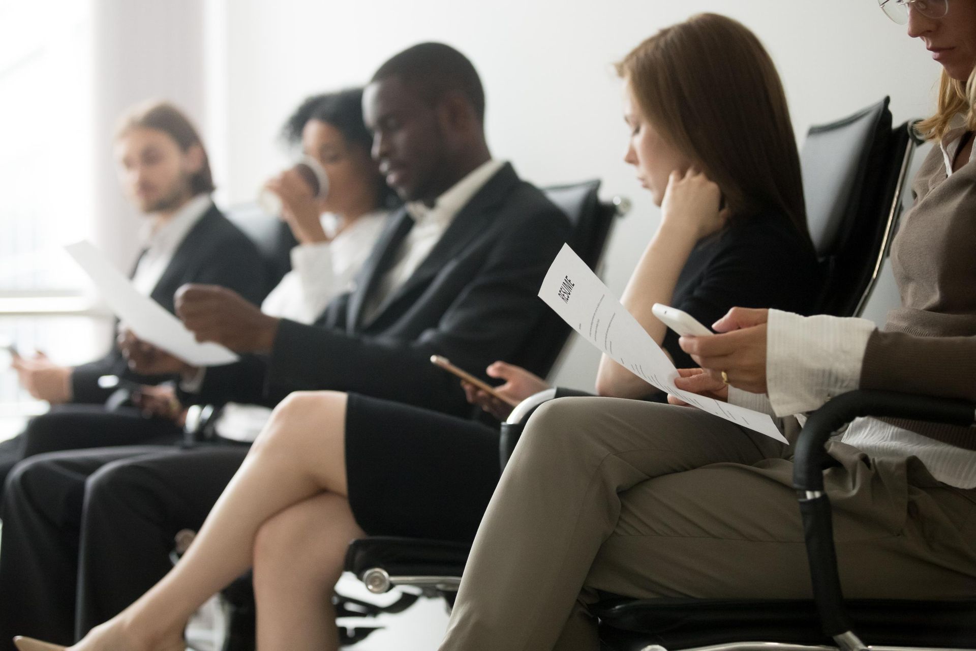 A group of people are sitting in chairs.