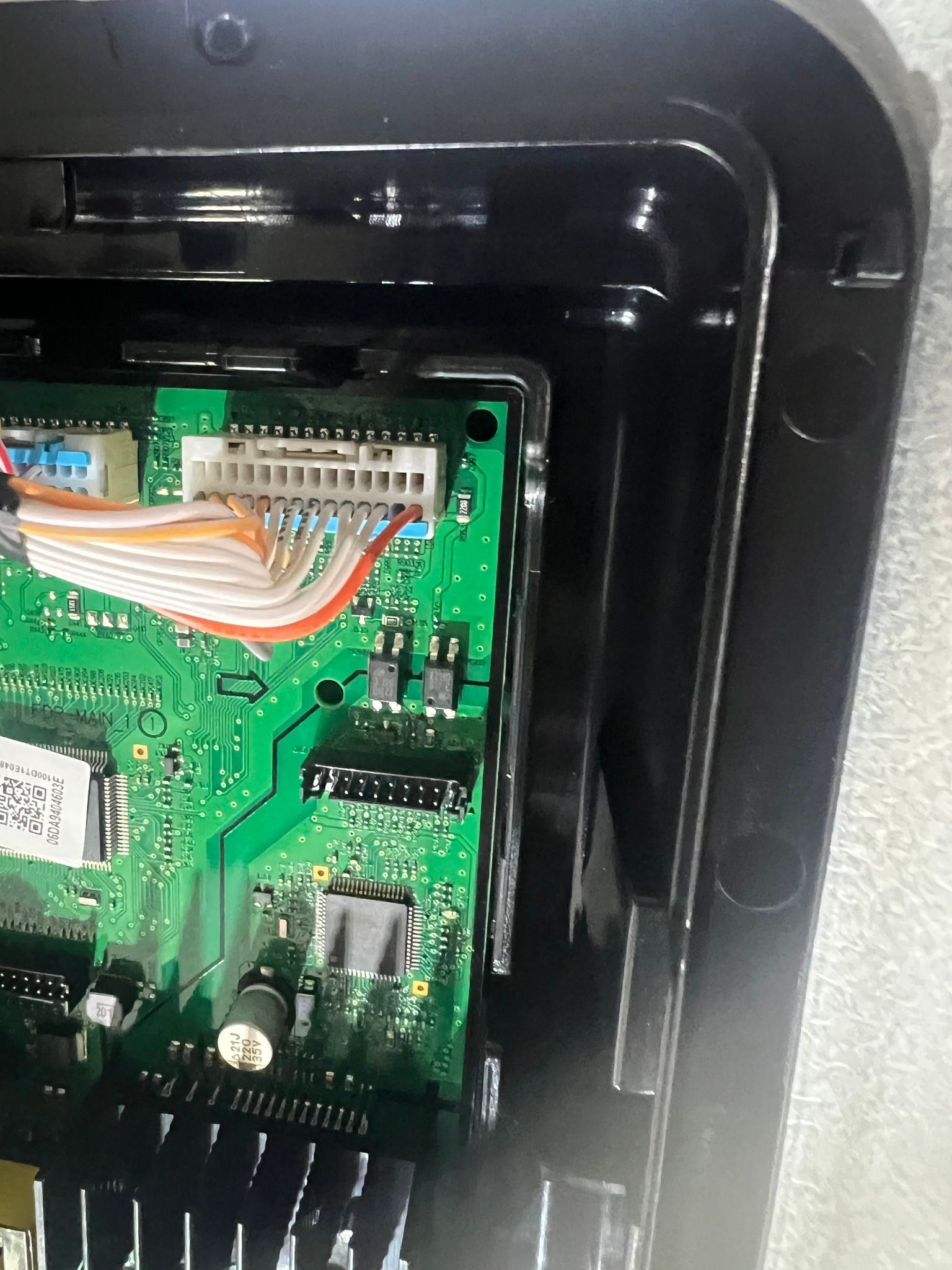 A close up of a motherboard with a bunch of wires coming out of it