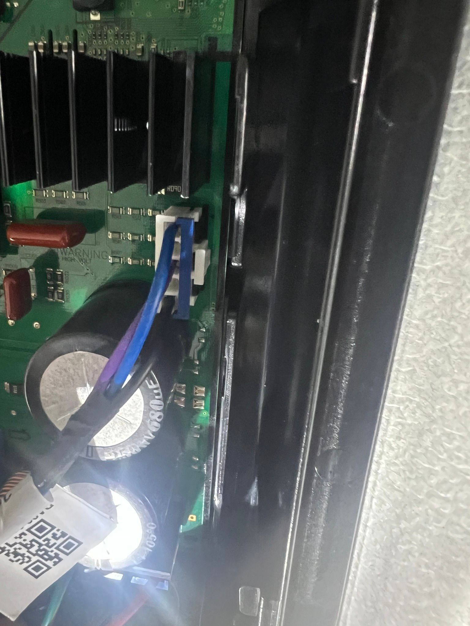 A close up of a motherboard with a qr code on it