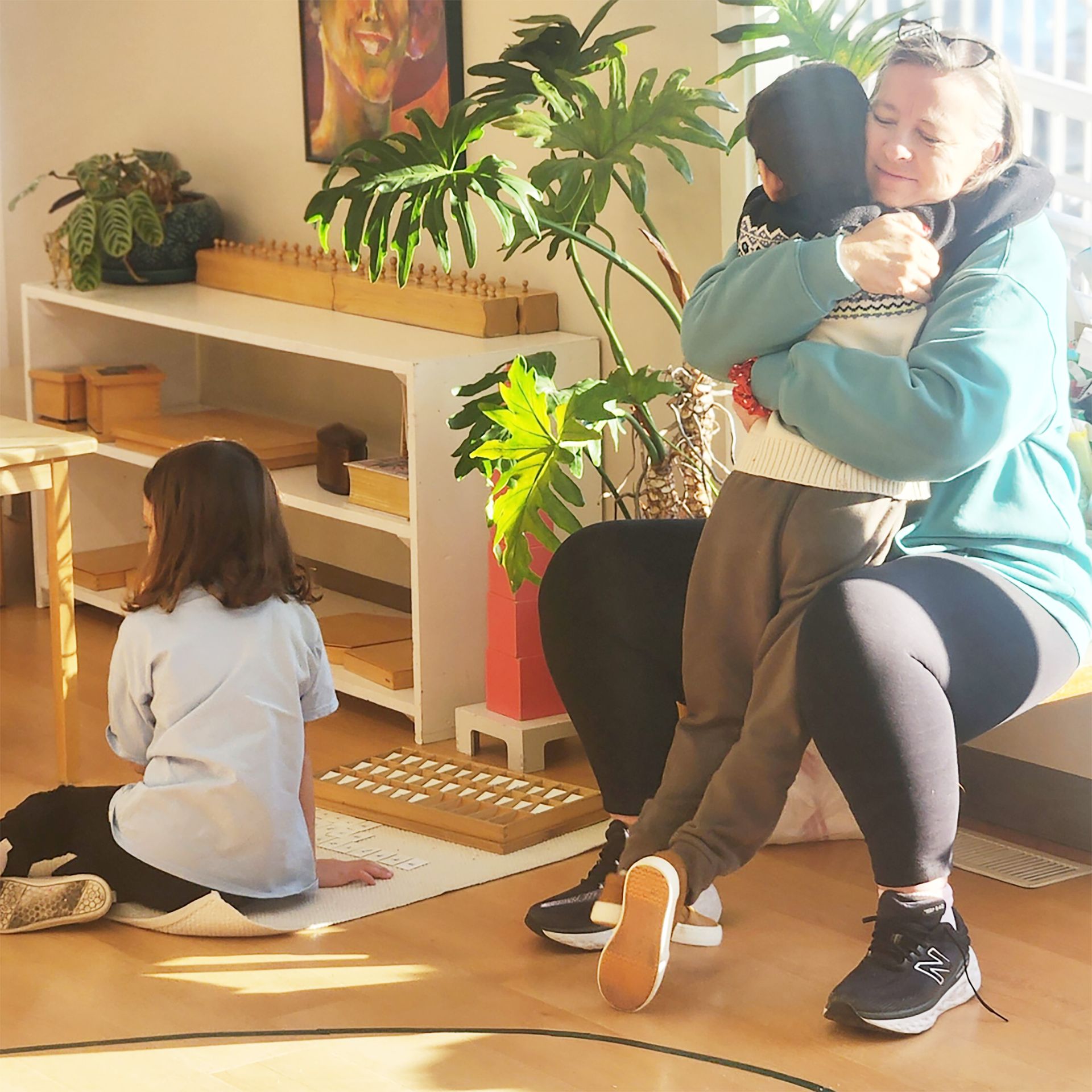 Montessori child and guide in the classroom