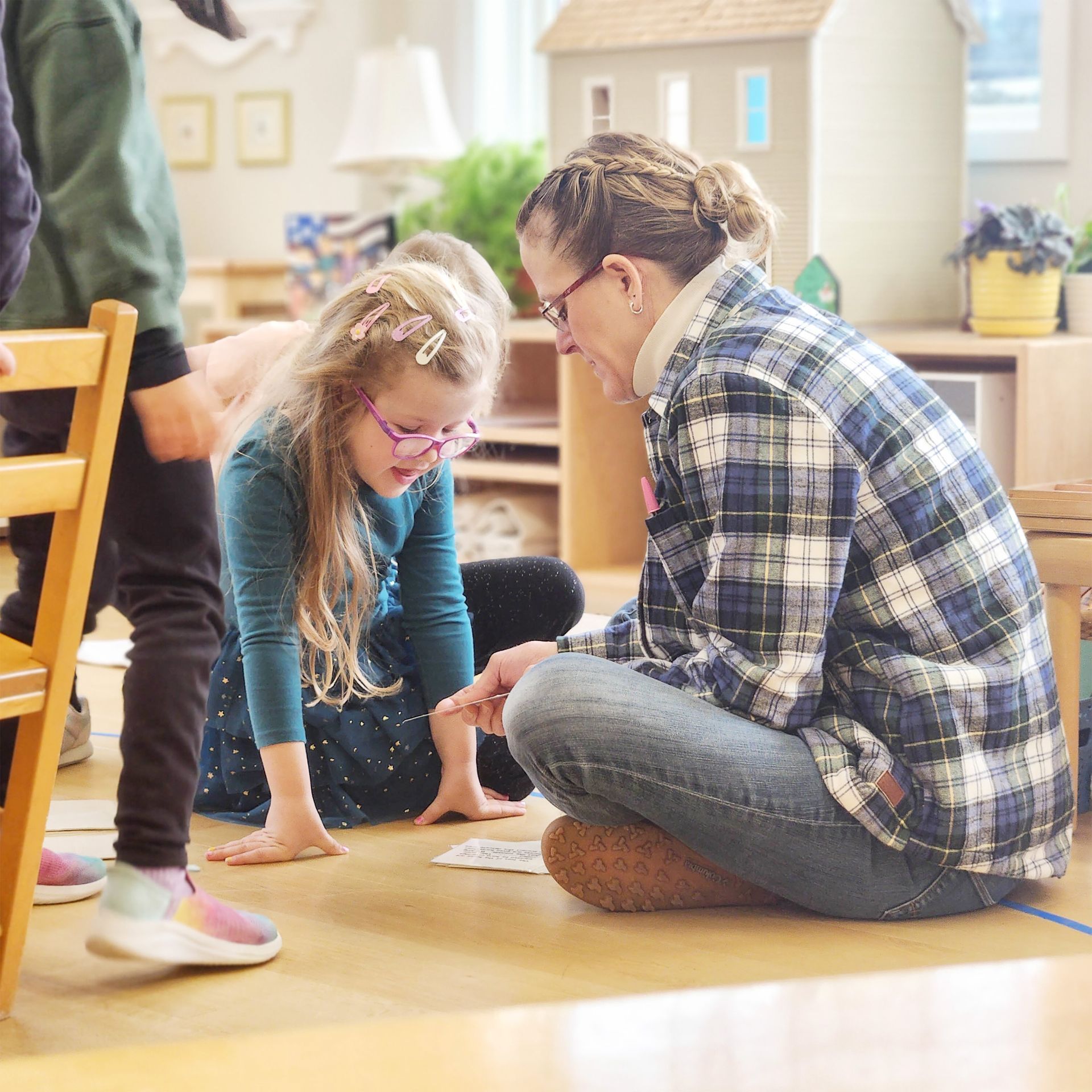 Montessori child and guide in the classroom