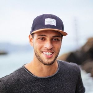 man with cap smiling
