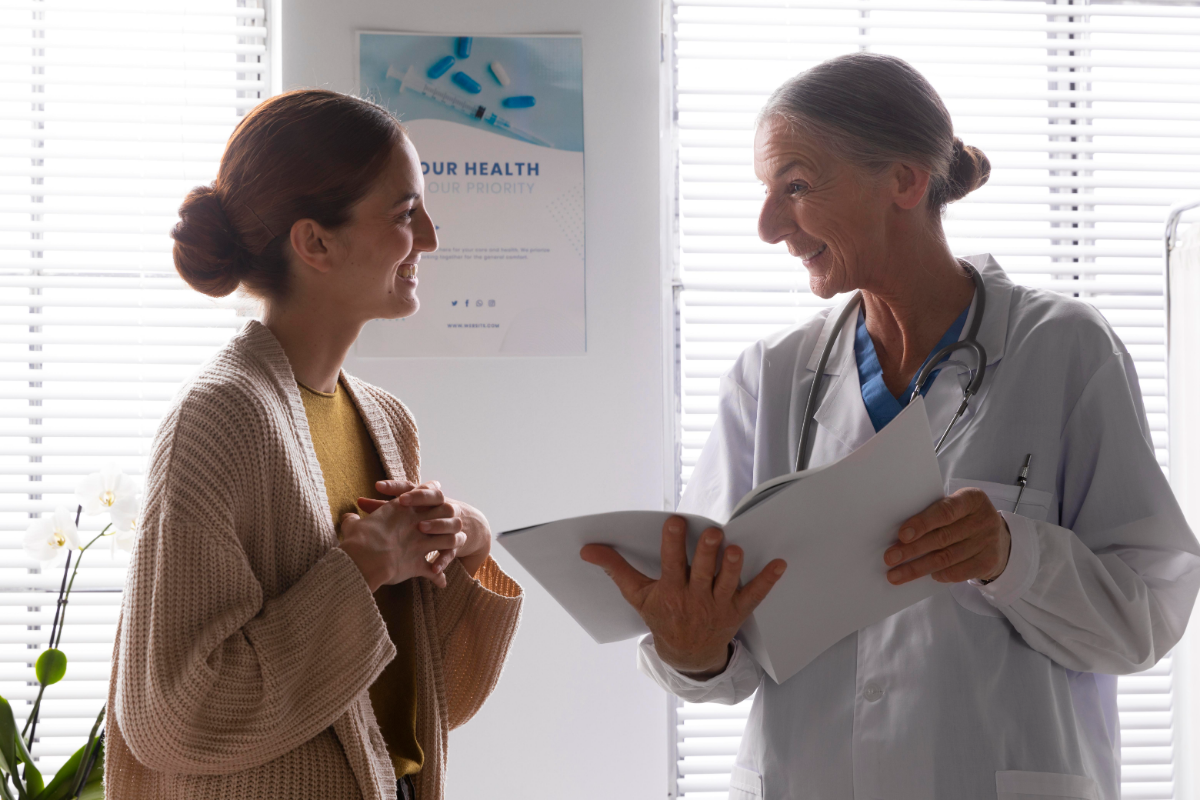 A woman attending her annual wellness visit and listening to her doctor’s advice