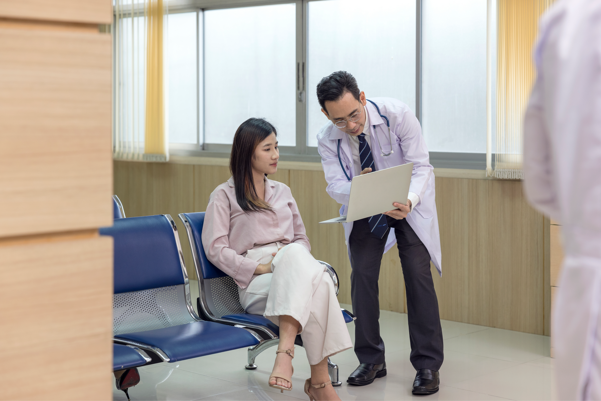 A female patient receiving preventive health services advice from her doctor