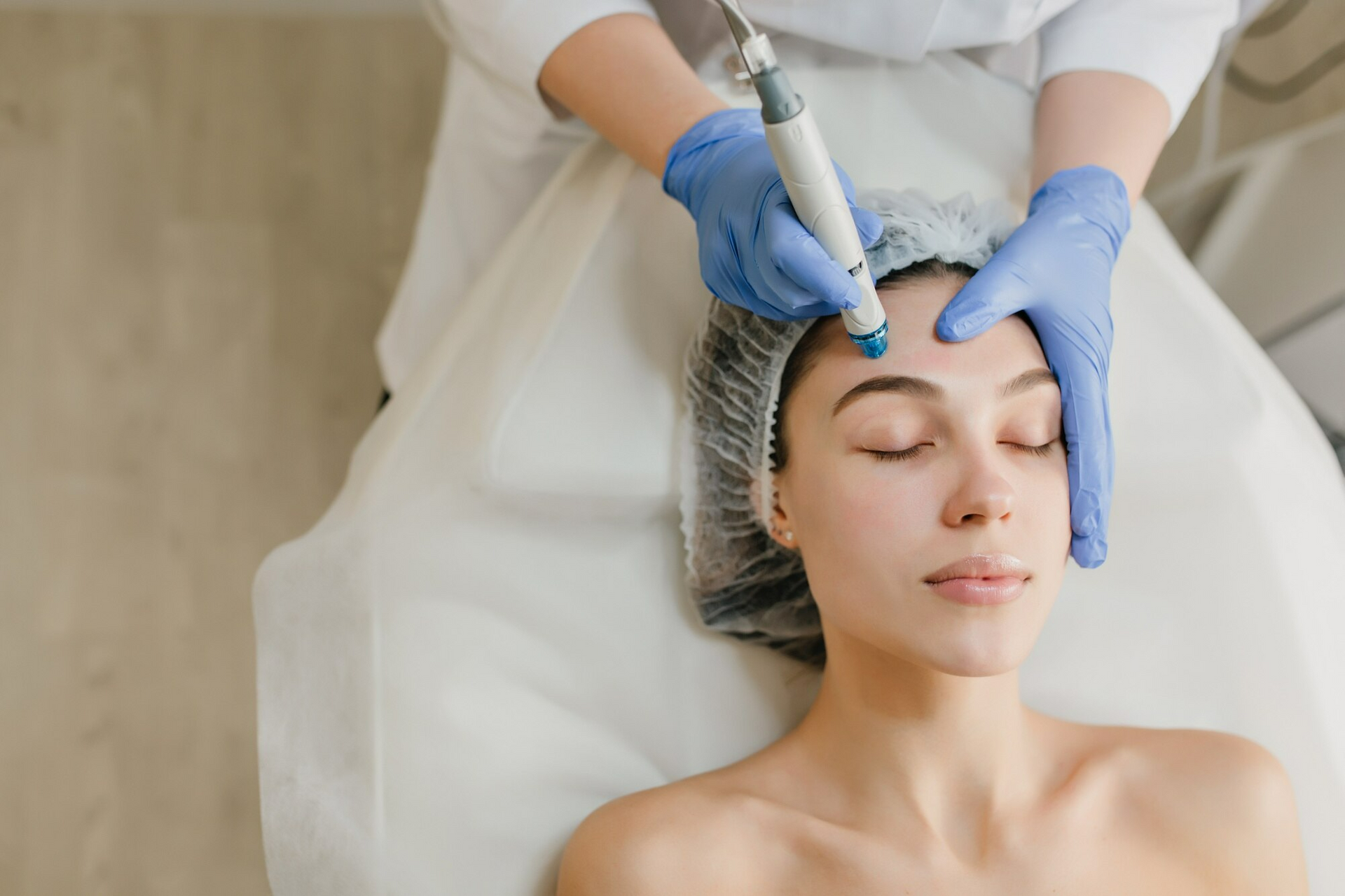  A woman receiving non-surgical cosmetic skin treatment.
