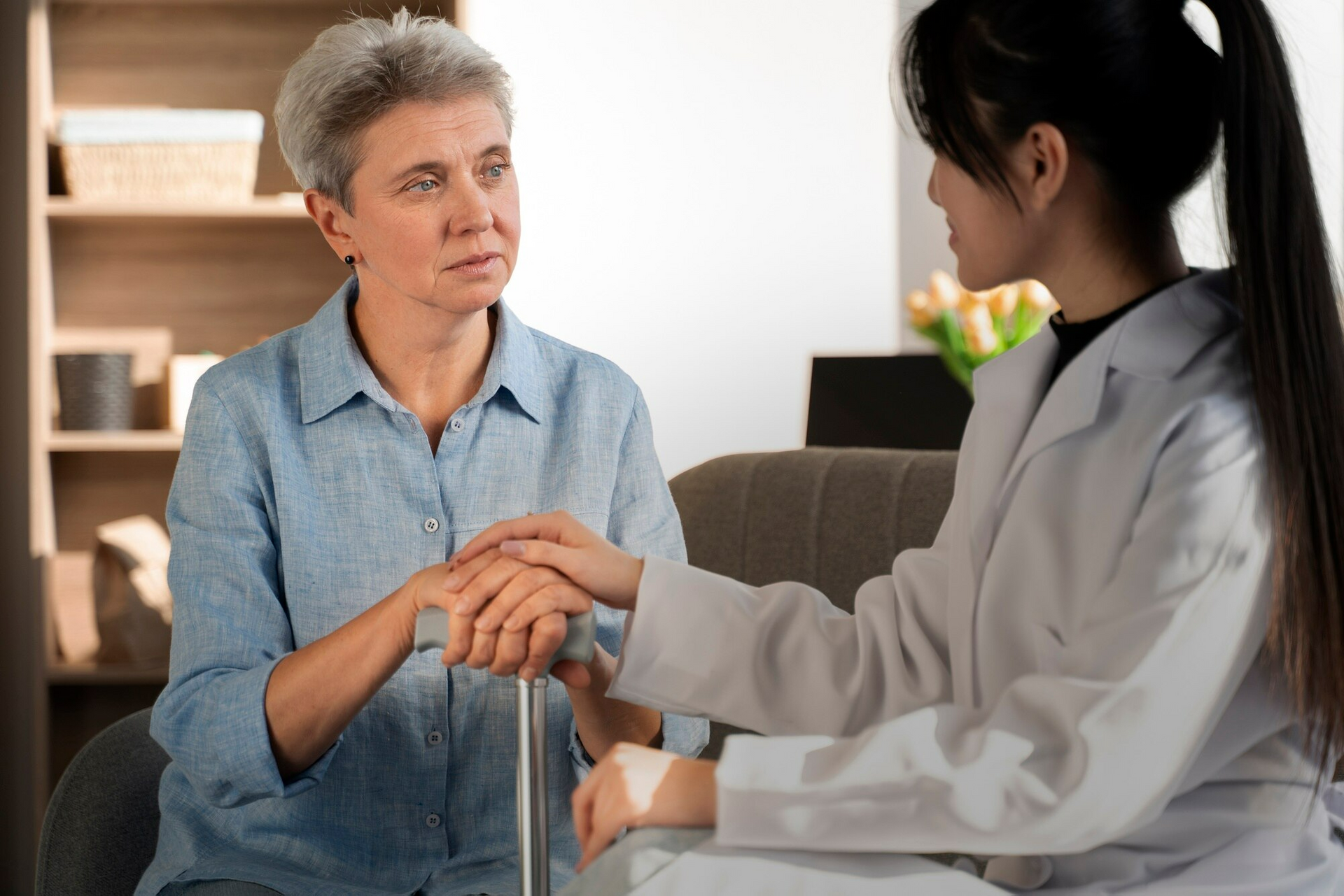 A healthcare provider gives her patient chronic condition management tips.