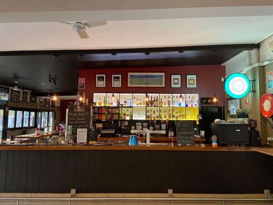 A Bar in A Restaurant with A Lot of Bottles on The Shelves — Roundabout Inn in Gloucester, NSW