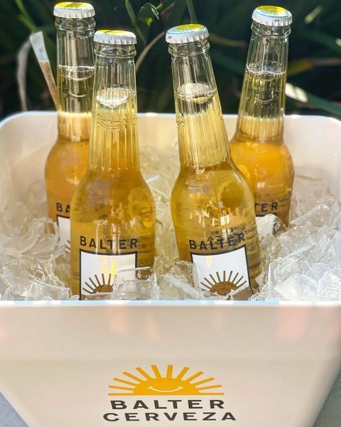Four Bottles of Balter Cerveza Are in A Bucket of Ice — Roundabout Inn in Gloucester, NSW