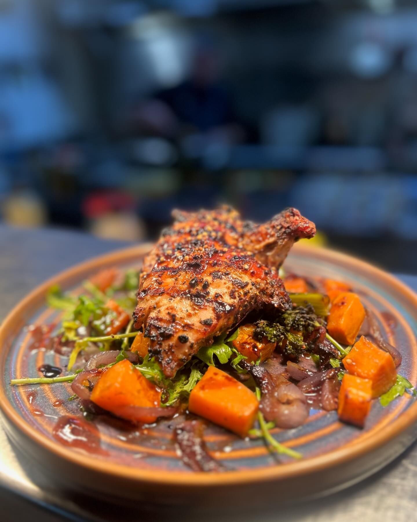 A Close up Of a Plate of Food with Meat and Vegetables on A Table — Roundabout Inn in Gloucester, NSW