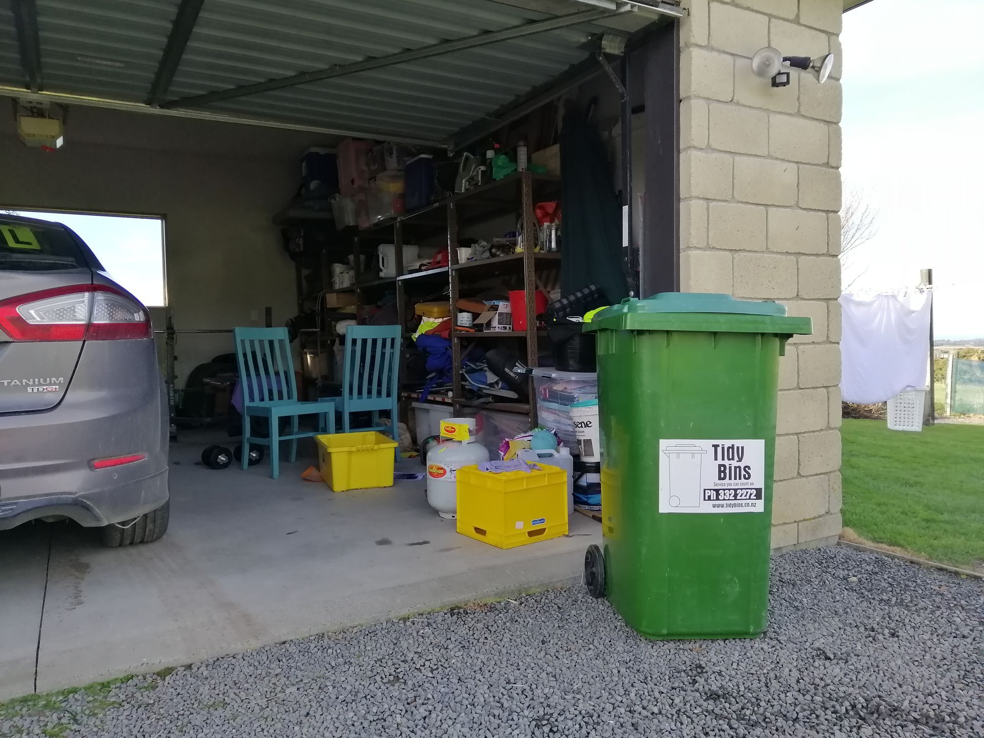 A Tidy Bins Wheelie Bin in a garage before residential collection.