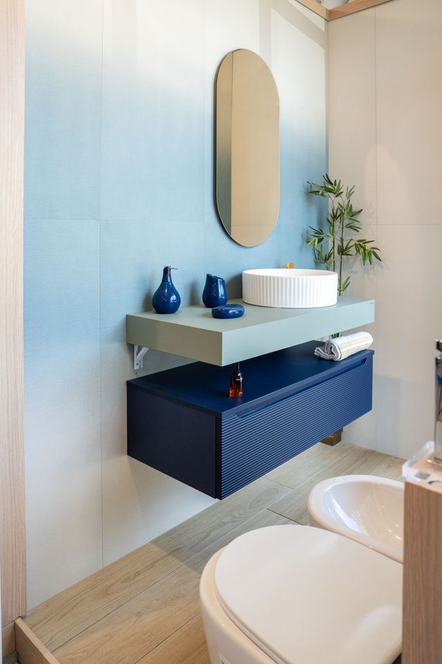 Chrome bathroom accessories set: toilet brush, cup holder, soap dispenser, toilet paper holder, and towel bar.