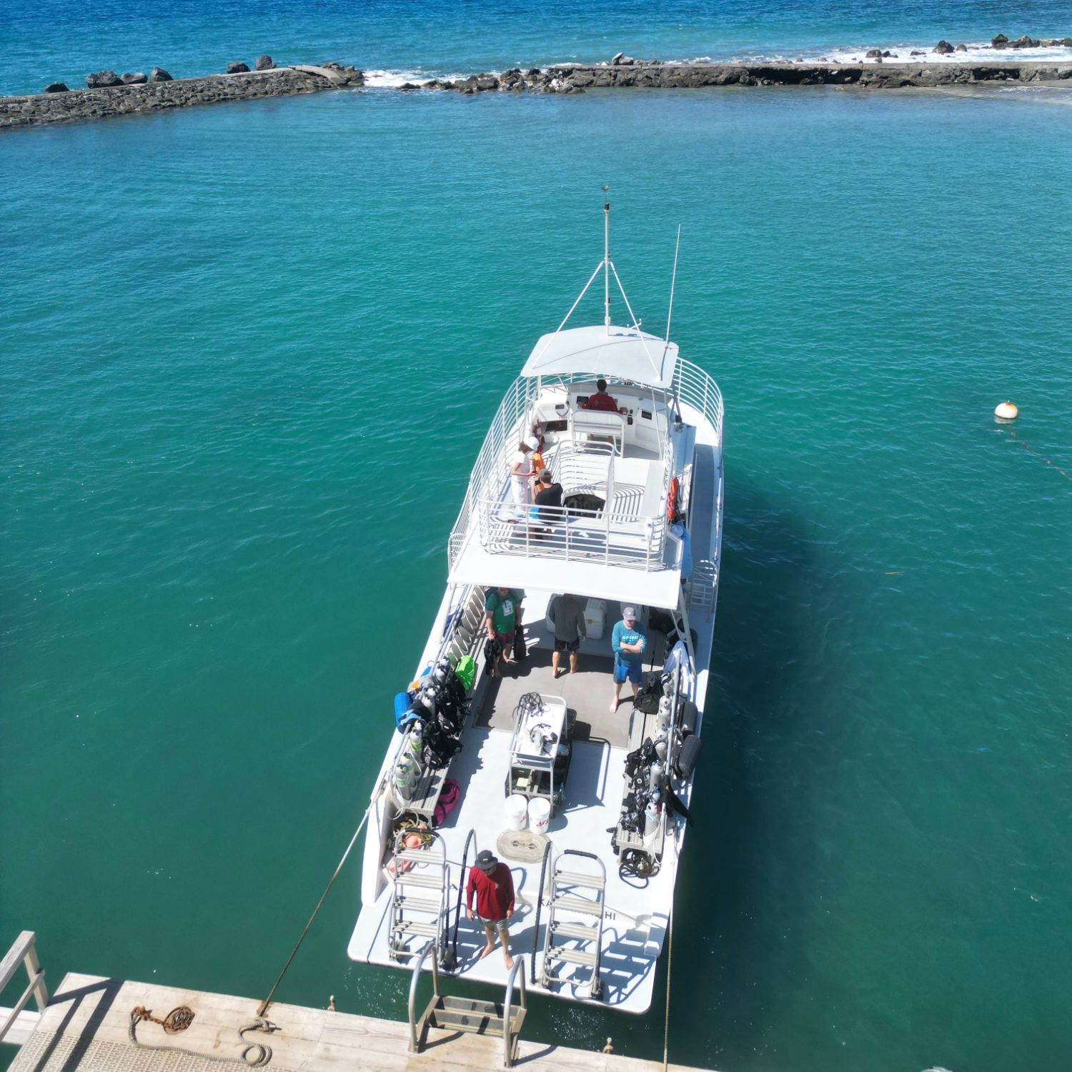 A boat is docked at a dock in the ocean