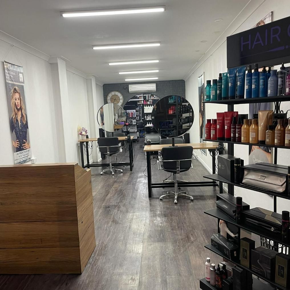 The Inside of A Hair Salon with A Lot of Products on Shelves — Main Hair Design in Armidale, NSW