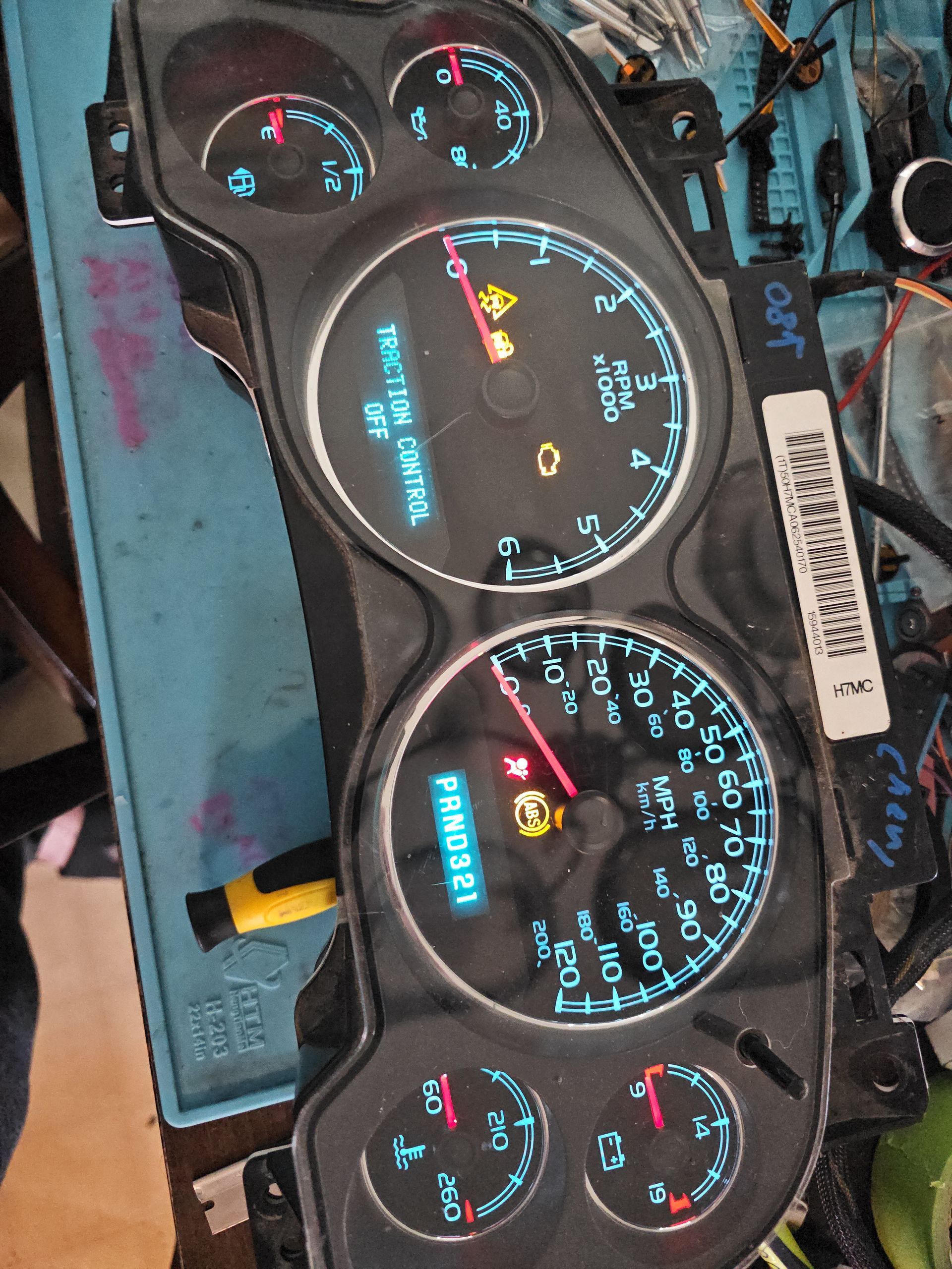 A close up of a gauge that says ' rpm ' on it