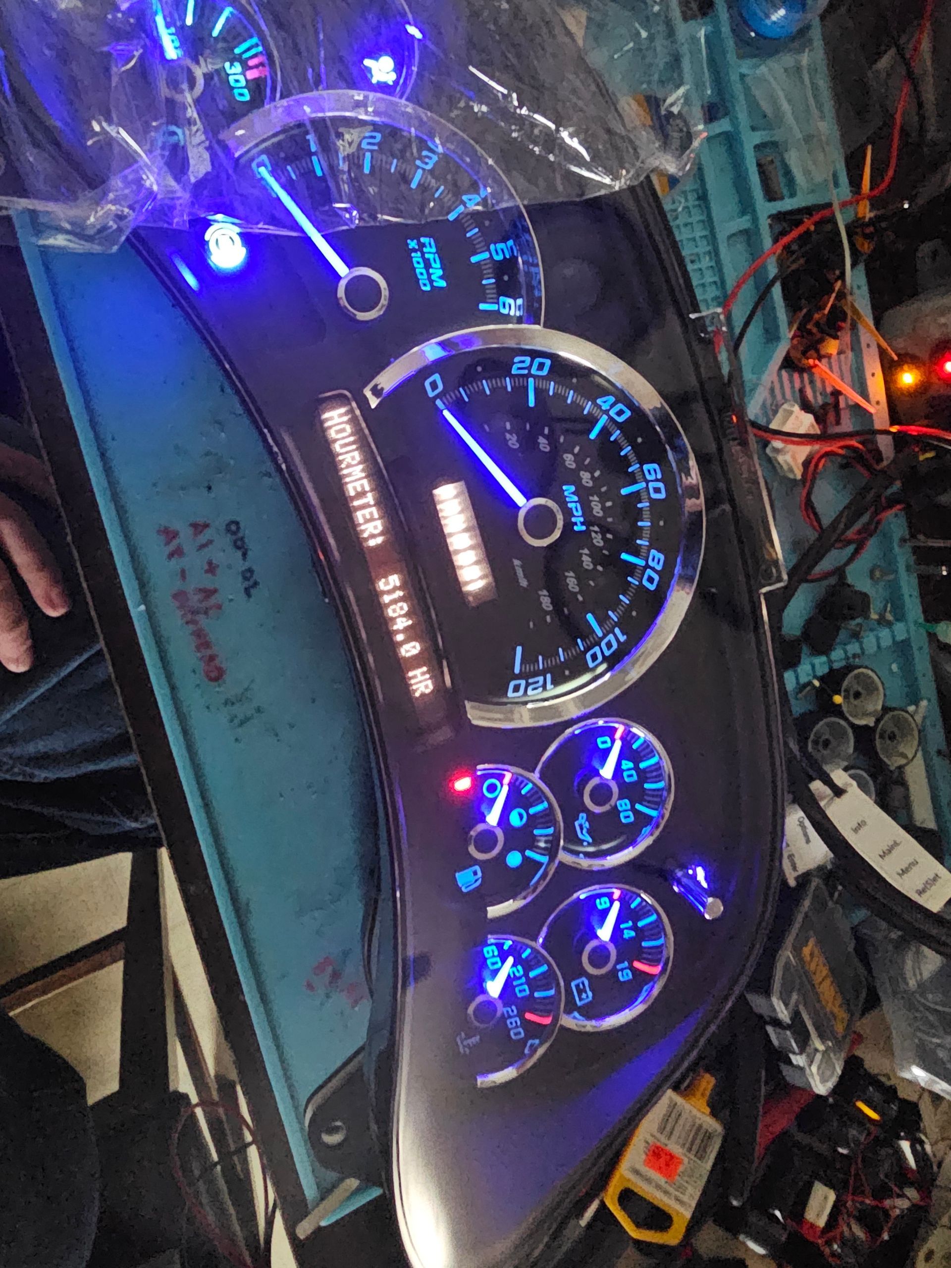 A close up of a dashboard with blue lights on it