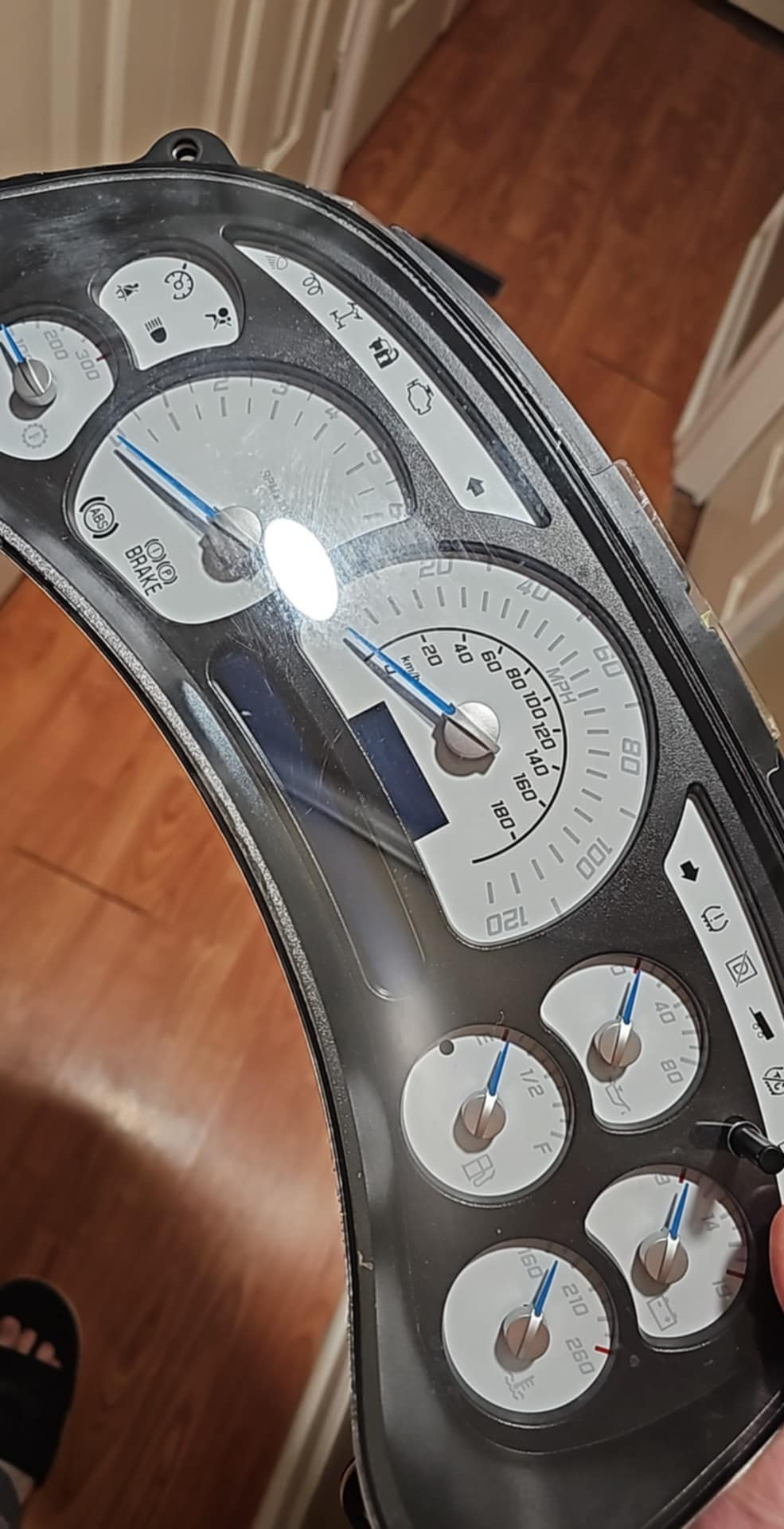 A person is holding a dashboard in their hand.