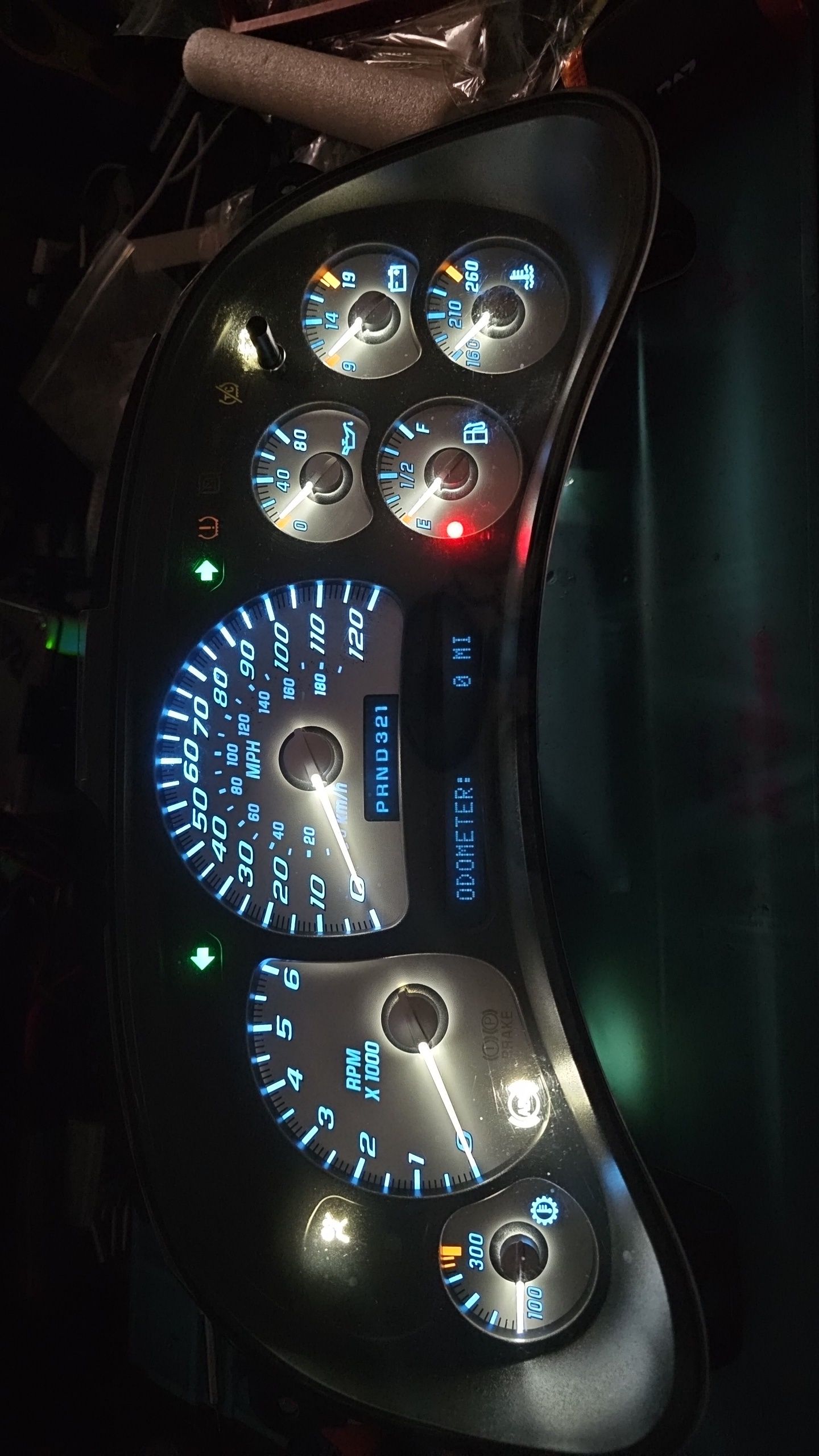 A close up of a car dashboard at night
