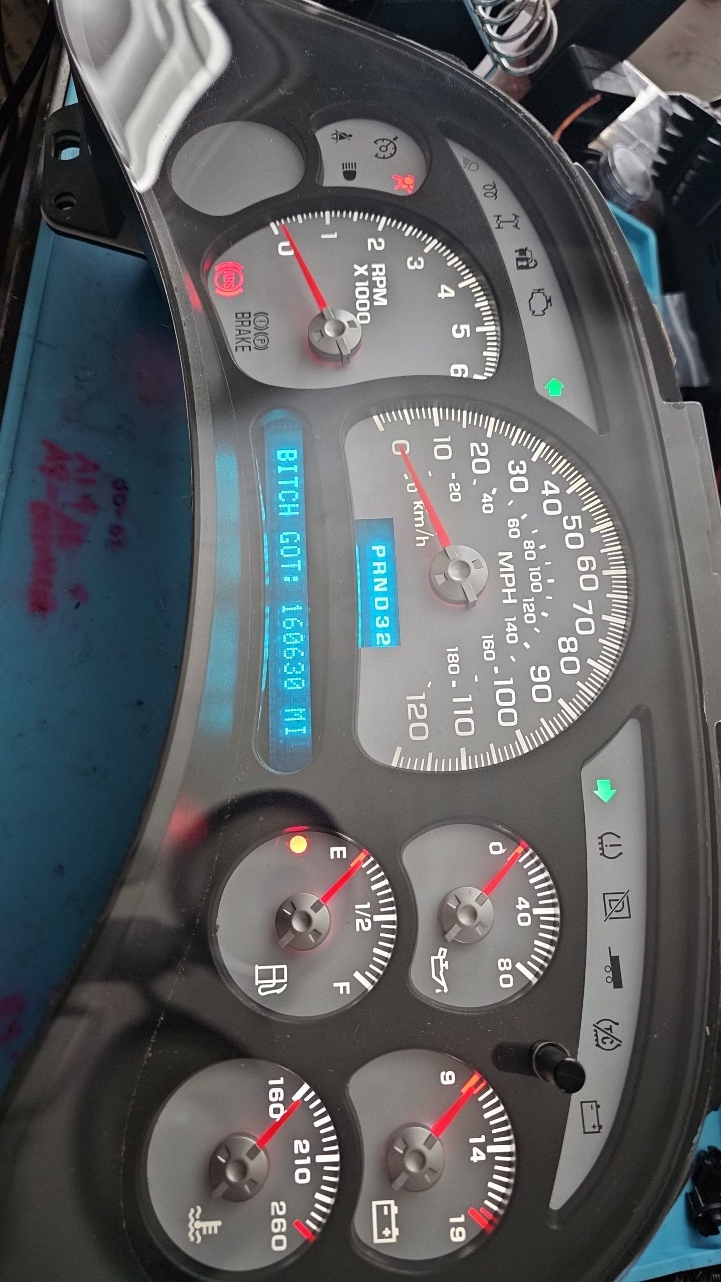 A close up of a car dashboard with a digital display.