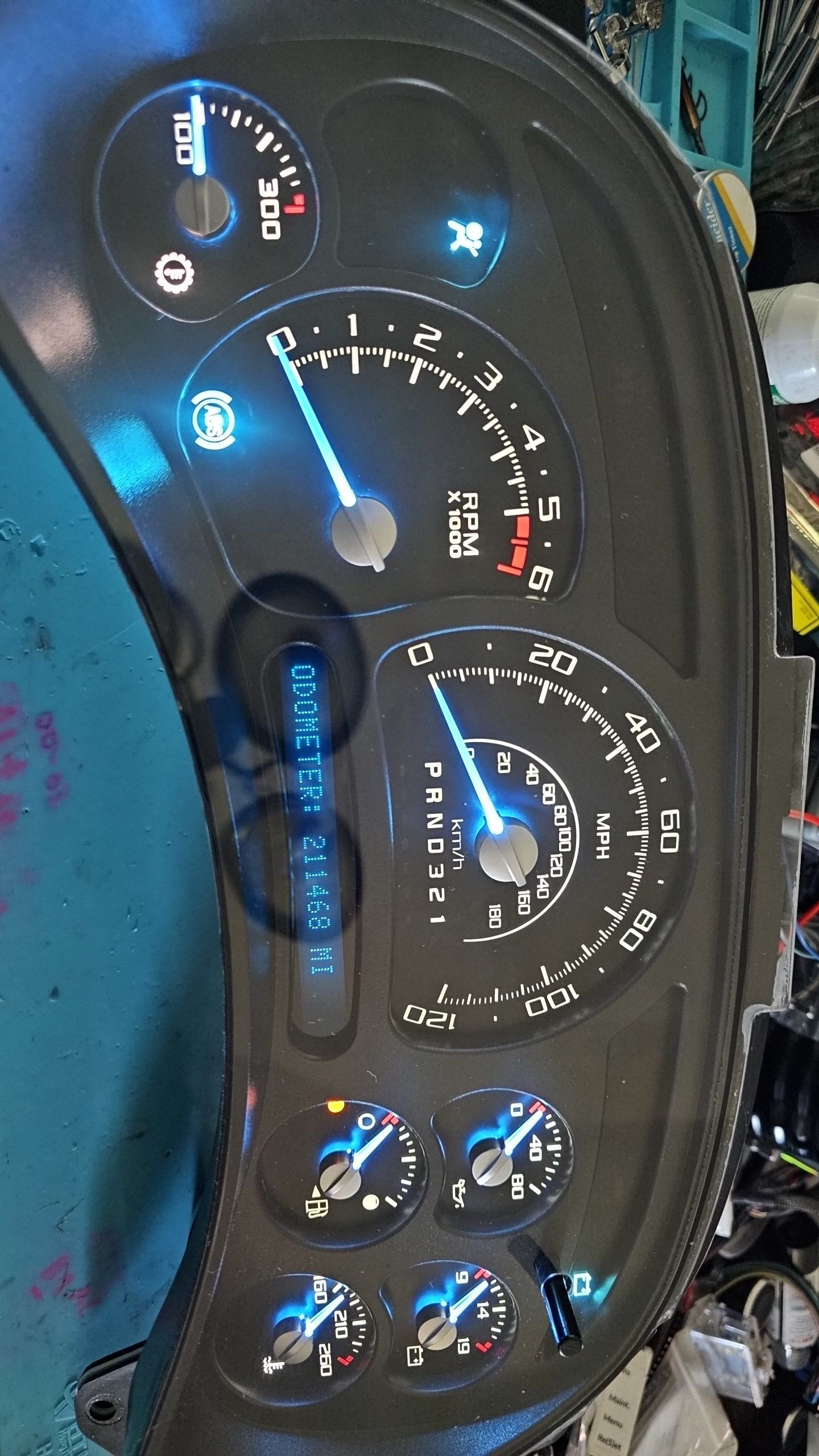 A close up of a dashboard with a lot of gauges on it