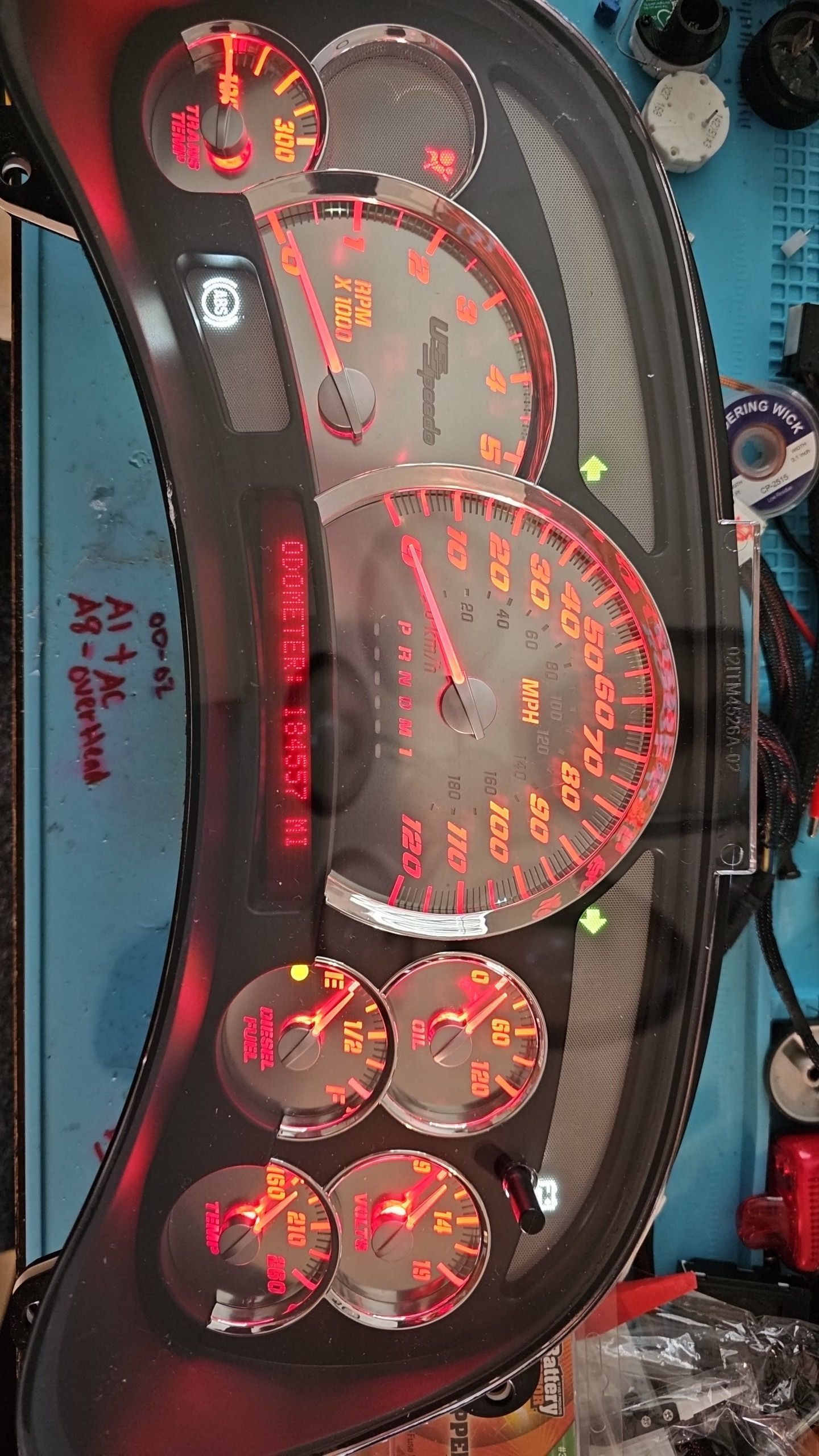 A close up of a dashboard with a lot of gauges on it.