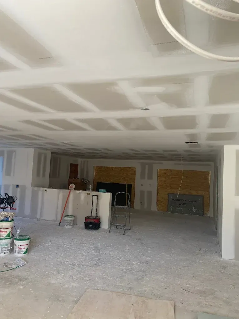 A large room with a remodeled ceiling.